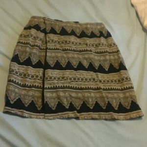 La Madei wrap around skirt Black amd Gold above knees